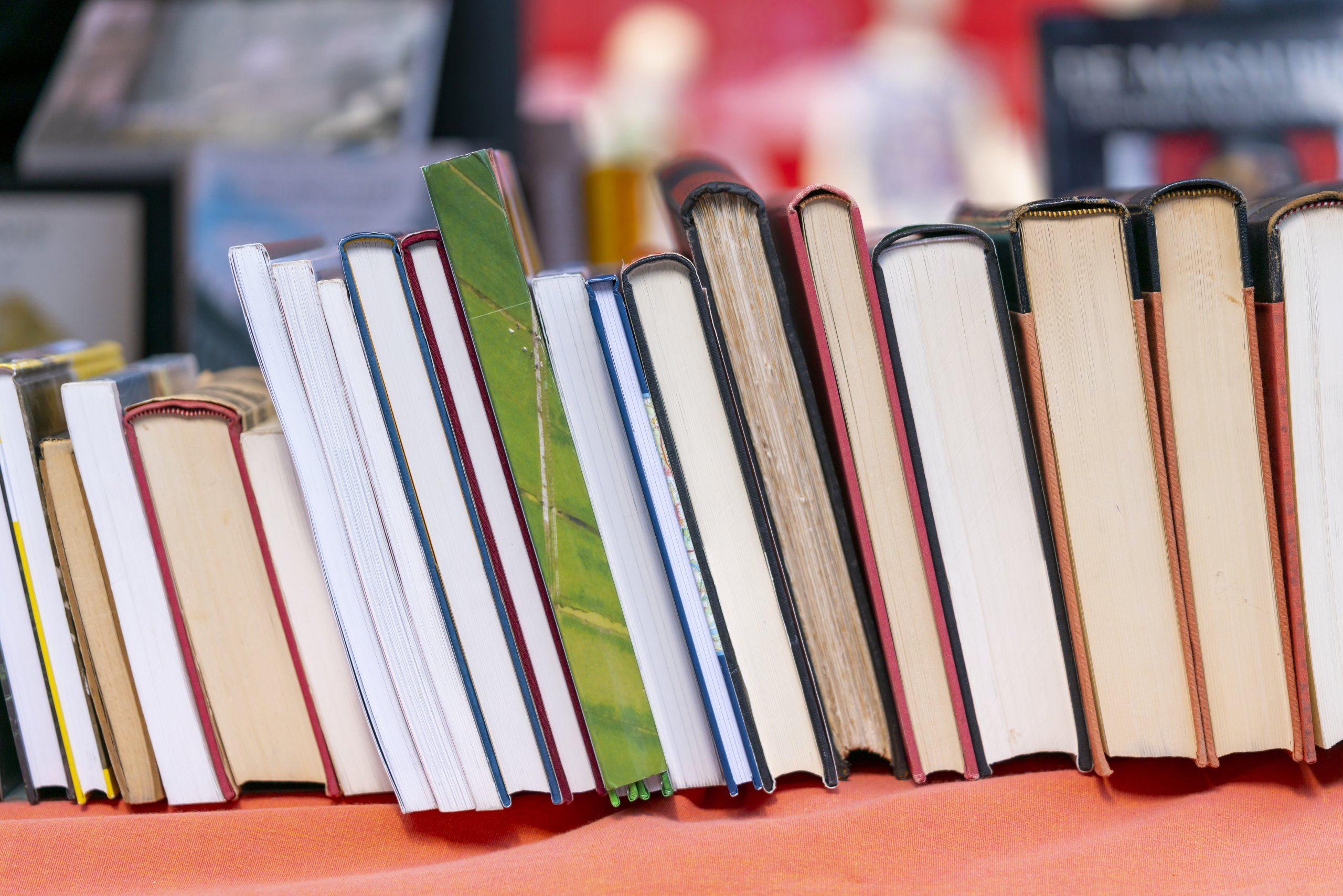Pile of books stacked on their edge