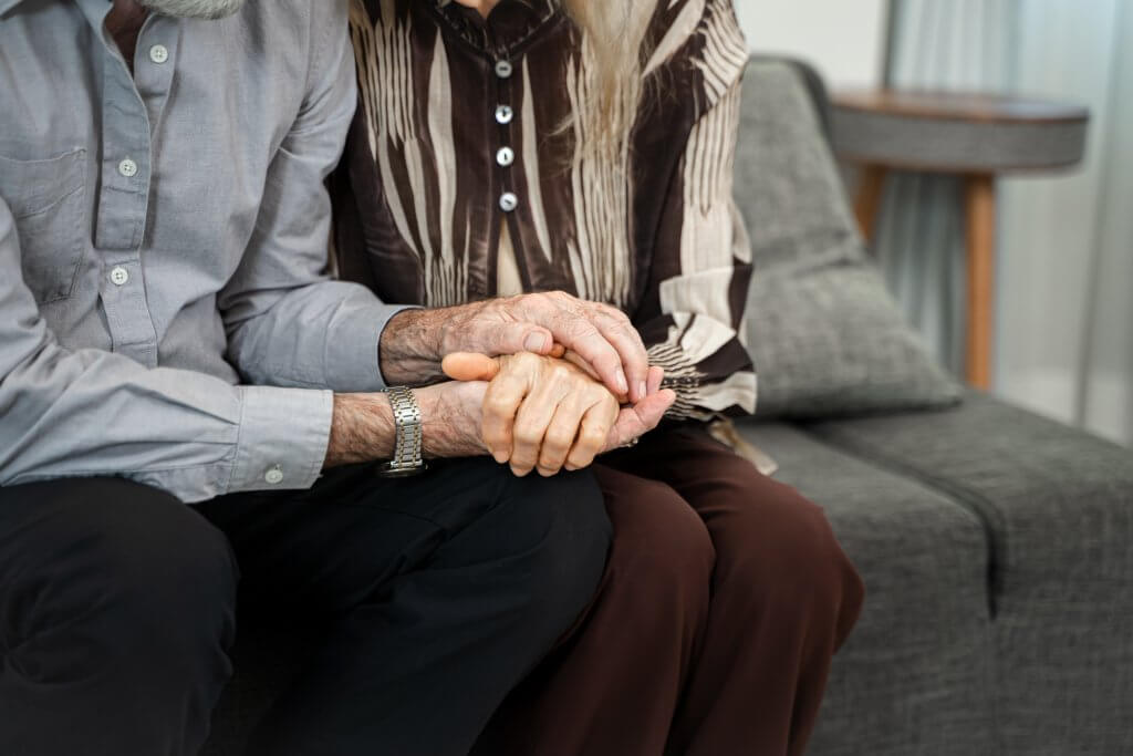 Close up mature spouses holding hands,Support,Couple hands holdi