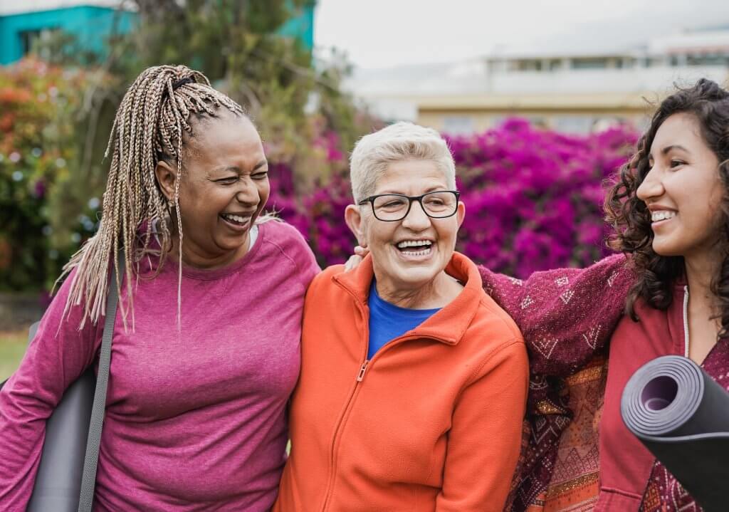 Happy multi generational women having fun together after yoga cl