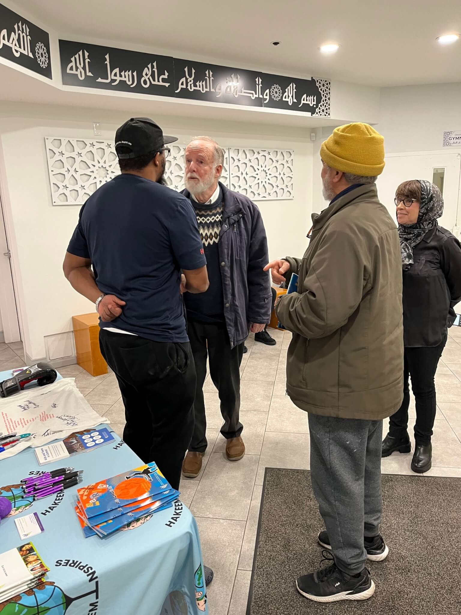 people talking at the richmond jamia mosque
